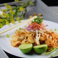 Pad Thai · Stir fried thin rice noodles with green onions, bean sprouts, egg and crushed peanut in tama...