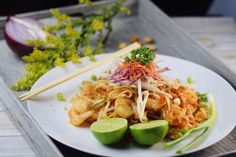 Pad Thai · Stir fried thin rice noodles with green onions, bean sprouts, egg and crushed peanut in tamarind sauce.