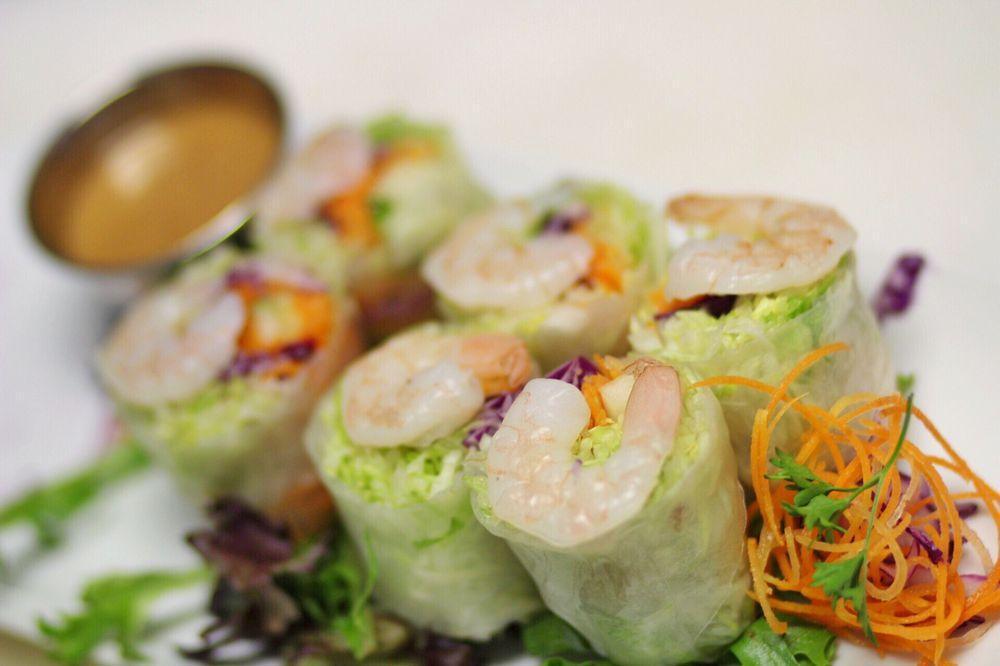 Fresh Summer Rolls · Lettuce, carrots, cucumber and rice noodles wrapped in fresh rice paper. Served with peanut sauce. 