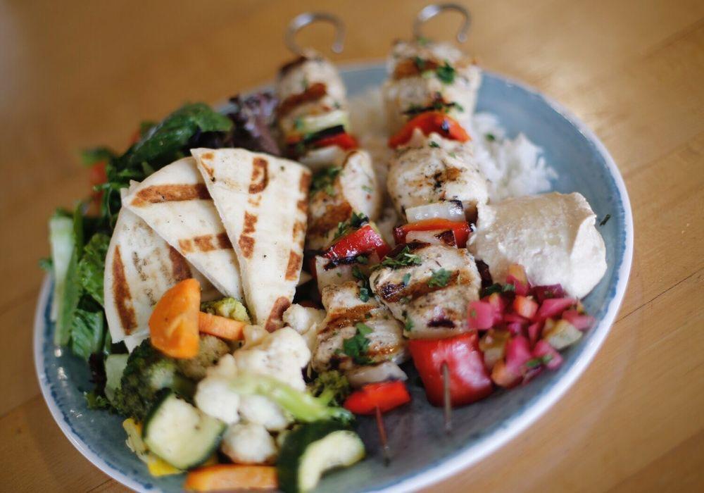 Kabob · 2 skewered grilled chicken breast marinated in lemon juice and herbs, hummus & pita, pickles. Served with choice of rice or quinoa and seasonal veggies.