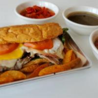 Lomito · Pork steak sandwich with ham, cheese and egg.