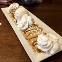 The Neo Nutella Crepe · Nutter Butters, Nutella, Reese's peanut butter sauce, whipped cream and chocolate gelato.