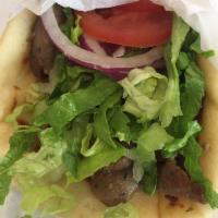 Lamb Gyro · A sensational blend (rotisserie) of beef and lamb meats seasoned with zesty spies, thinly sl...