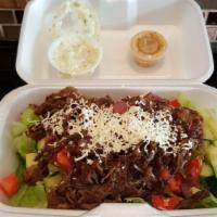 Lamb Salad · Lettuce, grilled onion, tomato, cucumber and mixture of beef and lamb topped with feta chees...