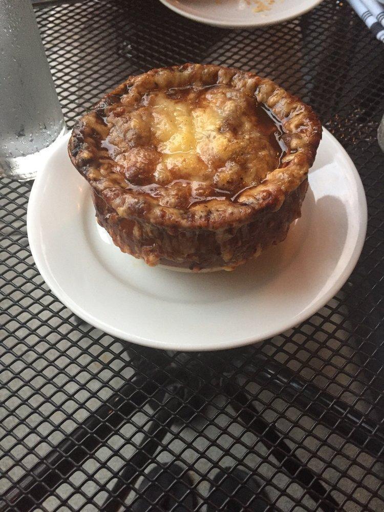 French Onion Soup · Slowly cooked broth, caramelized onions and cheese.