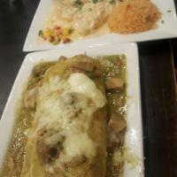 Chile Verde · A plate of tender pork wedges, slow-roasted and marinated in signature green chile verde sau...
