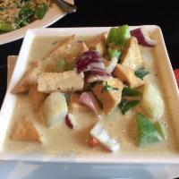 Green Curry · Basil leaves, potatoes, onions and bell peppers slow cooked in spicy green curry. Hot and sp...