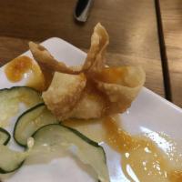 Crab Wonton · Crispy wontons (five) filled with cream cheese and Kani with tangy sweet sauce.
