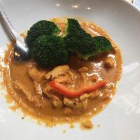 Panang Curry · Peanuts, red curry, coconut milk, kaffir lime leaves and steamed broccoli. Mild spicy.