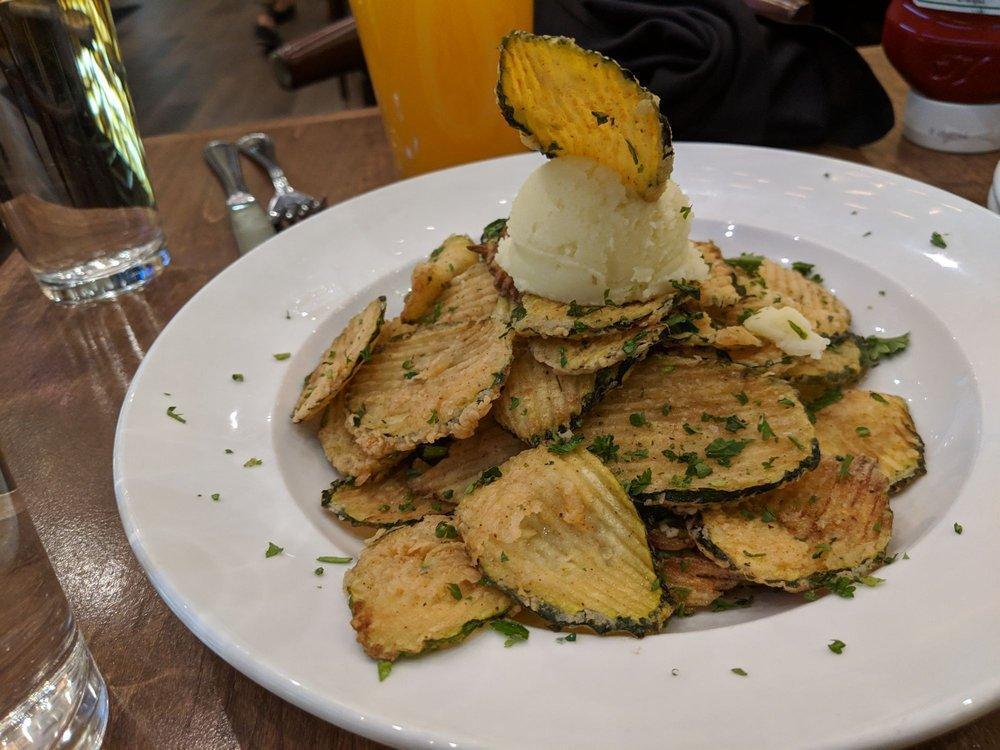 Zucchini Chips · Sliced zucchini chips served with our skordalia garlic dip.