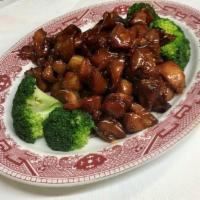Bourbon Chicken · Roasted chicken leg meat cut into chunks, marinated in good bourbon whiskey and garnished wi...