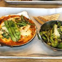Tuscan Ranchero · Eggs, mozzarella, basil braised in tomato sauce with avocado and roasted jalapeno.
Served wi...