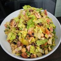 Toscana Chopped Salad · Romaine hearts, organic grilled chicken, Italian ham, Kalamata olives, garbanzo, heirloom to...