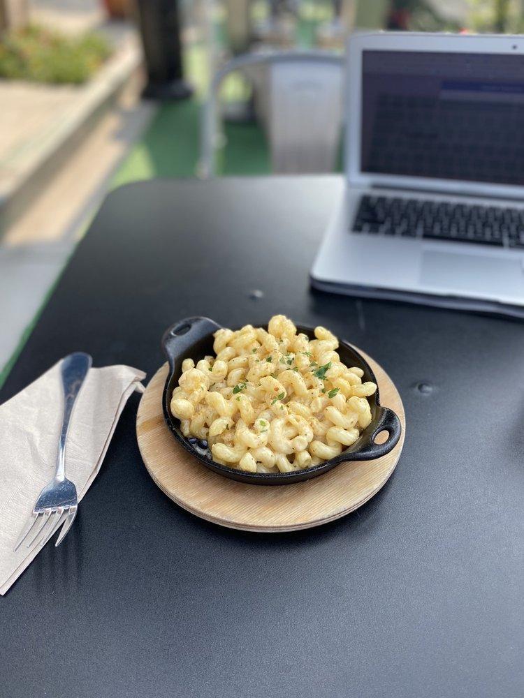 Truffle Mac · Truffle Mac & Cheese made with cavatappi pasta, a selection of imported cheeses, fresh cream and sprinkled with house made bread crumbs.