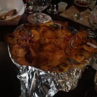 Loaded Chips · Our fried potato chips loaded with cheese, onions, tomatoes, jalapenos, chicken, and topped ...