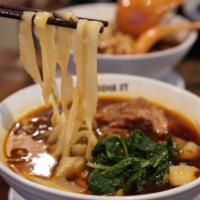 Dan Dan Noodle · Seasoned ground pork. Served with fresh spinach in a traditional light beef broth. Spicy.