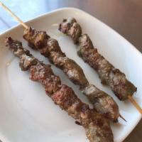 Lamb Skewers · 3 pieces. Cubed lamb blended with hints of cumin and ground red pepper. Served spicy.
