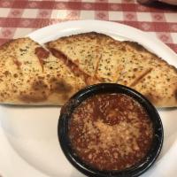 Calzone · We suggest 3 topping max to ensure proper cooking