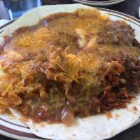 Huevos Rancheros · 2 flour tortilla with 2 eggs, hashbrown and beans smothered in green or red chili and cheese.