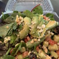 Cobb Salad · Spring mix tomato, avocado, cucumber, chicken, hard-boiled egg and bacon, your choice of dre...