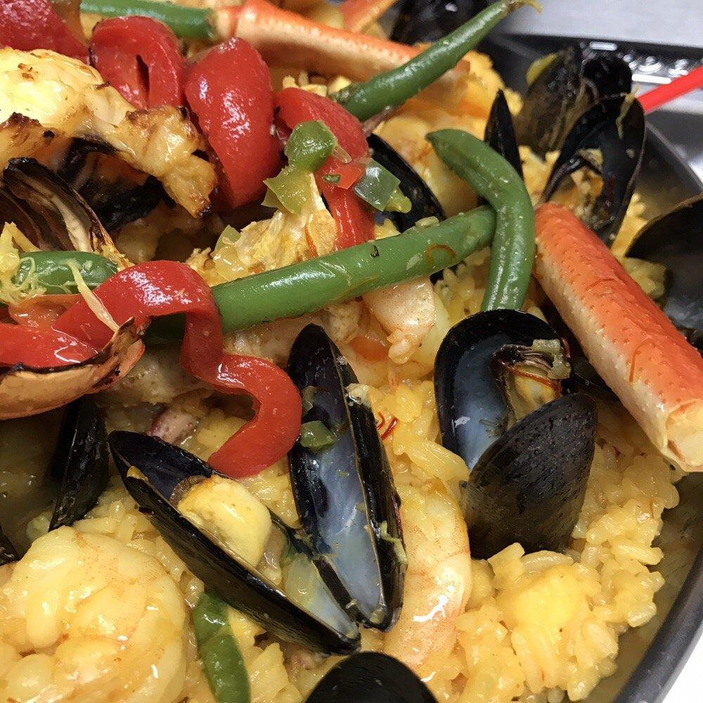Seafood Paella · For 2. Octopus, mussels, clams, lobster, calamari, shrimps, white fish, and saffron rice.