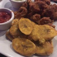 Chicharrones · Crispy fried chicken or fish chunks served with tostones or french fries