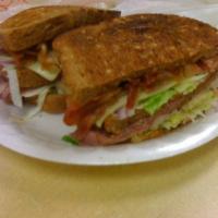 Double Club Sandwich · Triple decker, roast beef, turkey, bacon, cheese, mayo, mustard, veggies.