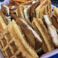 Chicken and Waffle Sandwich · Fried chicken cutlet, onion rings, in between 2 waffles with dipping sauce.