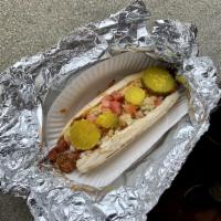 All American Dog · Topped with chili, cheese, chopped onions, tomatoes, pickle, mustard, relish.