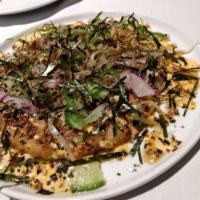 Okonomiyaki · Bacon, scallion, nori, bonito.