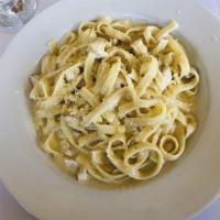 Fettuccine Alfredo · Fettuccine in white cream sauce and Parmigiano cheese.