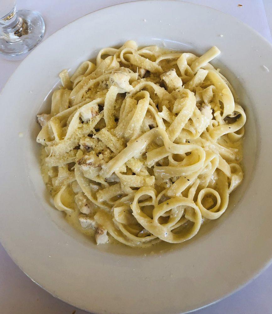 Fettuccine Alfredo · Fettuccine in white cream sauce and Parmigiano cheese.