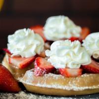 Strawberry Belgian Waffle · Belgian waffle topped with strawberries, whipped cream, and powdered sugar.