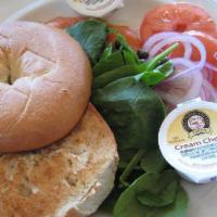 Lox and Bagel · Thinly sliced lox (cold smoked salmon) with capers, sliced red onion, tomato,
spinach leaves...