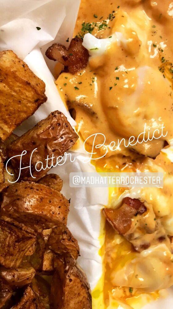Hatters Benedict · 2 poached medium eggs,  Two pieces of Applewood-smoked bacon, black beans on a toasted English muffin, topped with our signature spicy hollandaise sauce.  Substitutions always available: duck bacon for an additional charge. Comes with potatoes or fruit.