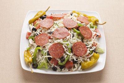 Italian Salad · Black olives, pepperoncini, pepperoni and mozzarella cheese. Served with Romaine and Iceberg lettuce, mushrooms, onions, green peppers and tomato.