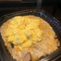 Southern Skillet · Potatoes with onions, green peppers, sausage, cheddar cheese, topped with sausage gravy and ...