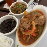 Ropa Vieja · Sauteed shredded beef with onions, green and red peppers. Served with a choice of 2 sides.