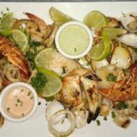 Cuban Seafood Platter · Seafood mix that includes shrimp, lobster tail, your choice of either Mahi-Mahi or salmon, a...