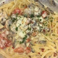 Spicy Antonio · Sauteed with fresh garlic, parsley, mushrooms, and diced tomatoes in a spicy creamy alfredo ...