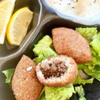4 Piece Kibbeh Makliyeh · Minced beef with cracked wheat, stuffed with ground beef and pine nuts.