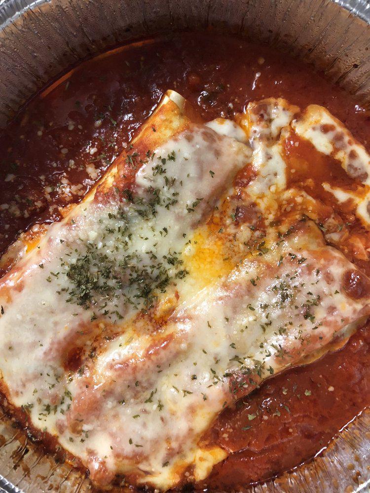 Manicotti · Homemade Manicotti pasta filled with Ricotta Cheese and herbs served in a fresh tomato sauce topped with Mozzarella Cheese