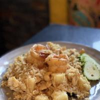 Pineapple Fried Rice · Chicken, shrimp, pineapple chuck, cashew nuts raisins and green onions.