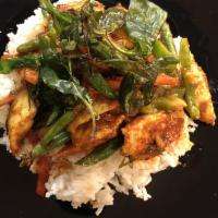 Red Curry · Red curry with Thai spices, coconut milk, carrots, pumpkin, bamboo shoots and basil. Comes w...