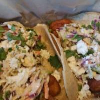Brew Co. Fish Tacos · 2 pieces. Beer-battered cod, cabbage, cilantro, Cotija cheese and white sauce with Chips and...