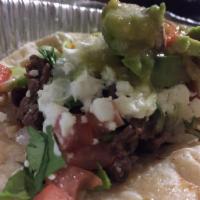 Tacos · One Taco Served on corn tortilla with cilantro, onions, lettuce, tomatoes, sour cream and fr...