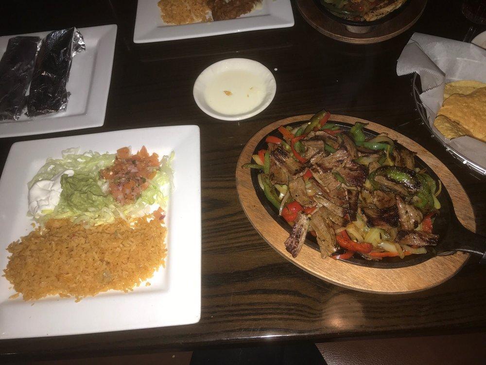 Fajitas · Choice of flank steak, chicken or mixed, served with two flour tortillas, rice, beans and salad with shrimp.