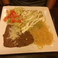 Enchiladas Verdes · 3 shredded beef enchiladas topped with green sauce, lettuce, sour cream and tomatoes. Served...