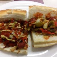 Italian Hot Dog · Comes with peppers, onions and potatoes in a red sauce.
