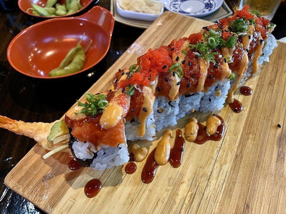 Dragon Roll · In: Shrimp Tempura, Crab, Cucumber
Out: Unagi, Avocado, Scallion, Sesame Seeds
Sauce: Unagi